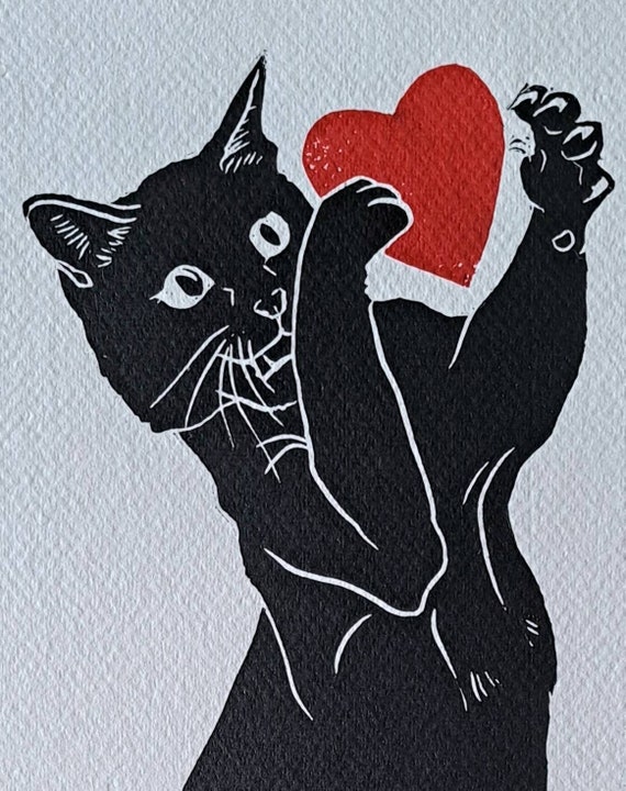 Chat noir jouant avec son coeur. Impression linogravure A3 ...