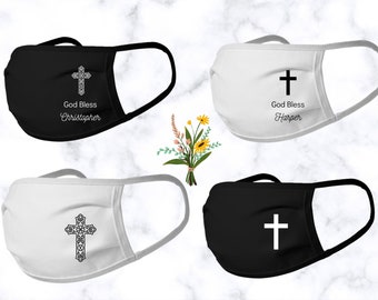 May include: Four face masks with a cross design. Two masks are black with white crosses and two masks are white with black crosses. The masks have the text "God Bless" and a name on them.