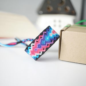 May include: A set of three ceramic mugs with a speckled, matte finish. The mugs are in shades of cream, light gray, and dark gray. Each mug has a simple, minimalist design, perfect for coffee or tea.