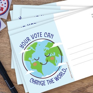 May include: A stack of blue postcards with a cartoon earth illustration. The earth has a smiling face and the text "Your Vote Can Change The World." is printed on the front.