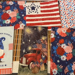 May include: Set of ten red, white, and blue patterned paper napkins with a patriotic theme. The napkins feature images of fireworks, a red truck, a gnome, stars, and stripes. The text "Stars and Stripes Forever" is printed on one of the napkins.