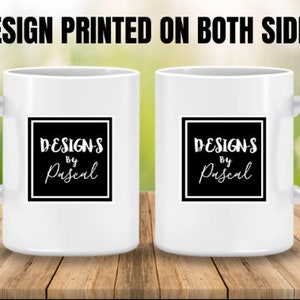 May include: Two white ceramic mugs with black square designs that say "Designs by Pascal" on both sides. The mugs are printed on both sides.