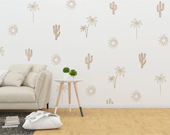 May include: A white wall with a beige couch and a small wooden side table. The wall is decorated with a repeating pattern of brown line drawings of cacti, palm trees, and suns.