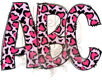 May include: The word "ABC" in a playful design. The letters are filled with a pink and black heart-shaped leopard print pattern. The letters have a black outline and are stitched with black thread.