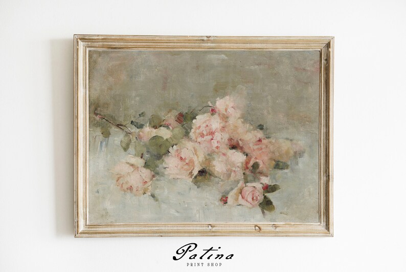 May include: A framed painting of a bouquet of pink roses with green leaves on a light blue background. The frame is a light wood color with a distressed finish.