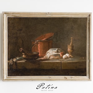 May include: A framed oil painting depicting a still life of kitchen items. The painting features a copper pot with a lid, a wooden bowl, a loaf of bread, eggs, and a wooden mortar and pestle. The painting is set against a dark brown background.