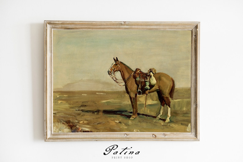 May include: A framed painting depicting a brown horse standing in a field. The horse is wearing a saddle and has a blanket on its back. The background is a hazy landscape with a mountain range in the distance.