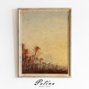 Puede incluir: Una pintura enmarcada de un paisaje con palmeras en primer plano y un cielo brumoso en el fondo. La pintura est&aacute; en un marco de madera claro.