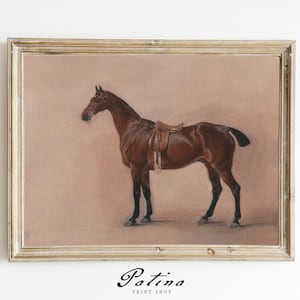 May include: A framed painting of a brown horse with a saddle, set against a light pink background.