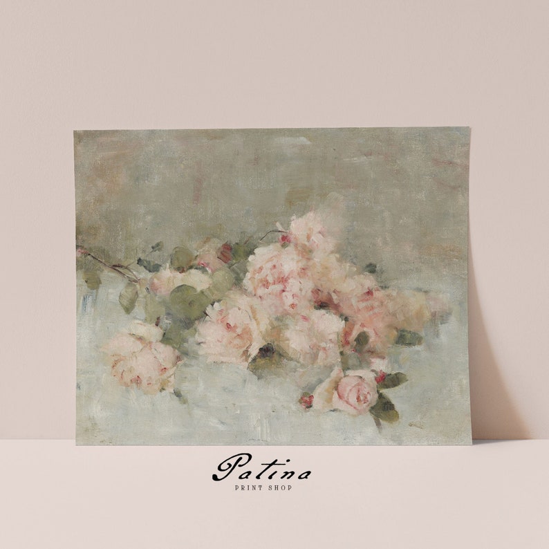 May include: A vintage-style painting of a bouquet of pale pink roses on a light blue background. The roses are arranged in a loose, natural way, and the painting has a soft, romantic feel. The painting is signed "Patina Print Shop" in the bottom center.