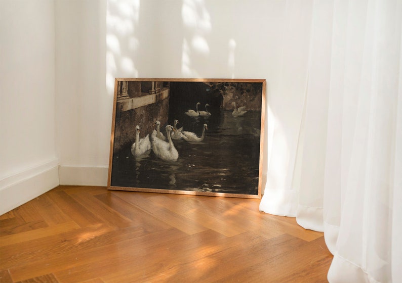 May include: A framed painting of a group of white swans swimming in a dark, murky water. The swans are in a row, with their heads turned to the side. The painting is set against a backdrop of a stone wall and a dark, shadowy area.