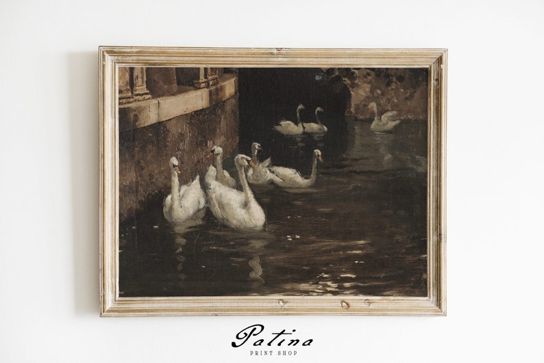 May include: A framed painting of a group of white swans swimming in a dark, murky pond. The swans are in a line, with their heads turned towards the viewer. The painting is set against a backdrop of a stone wall and trees.