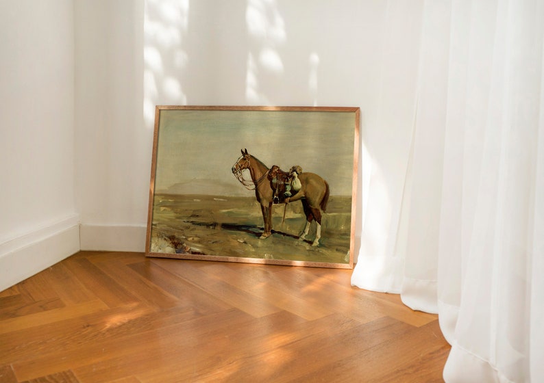 May include: A framed painting depicting a brown horse with a rider in a field. The painting is in a wooden frame and has a rustic feel.