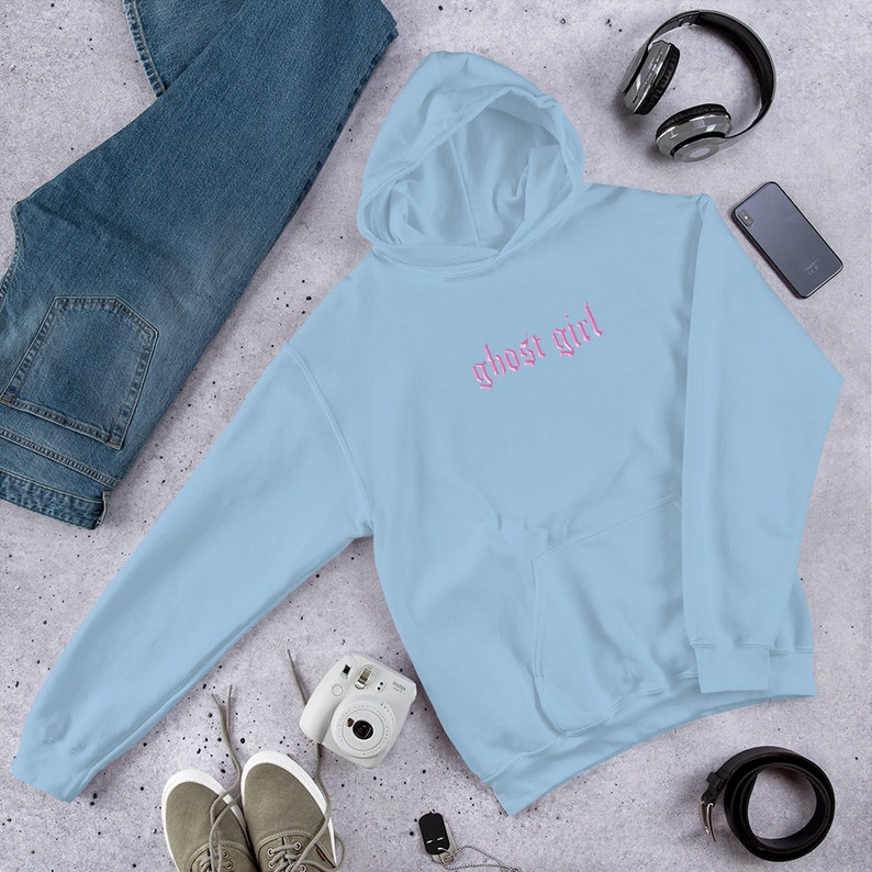May include: A light blue hoodie with a pink embroidered design that says "ghost girl" on the front.