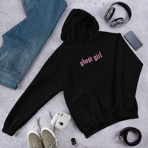 May include: Black hooded sweatshirt with a pink "ghost girl" graphic in a gothic font.