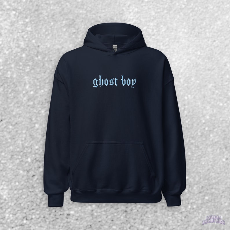 May include: A navy blue hooded sweatshirt with the text "ghost boy" in a light blue gothic font.