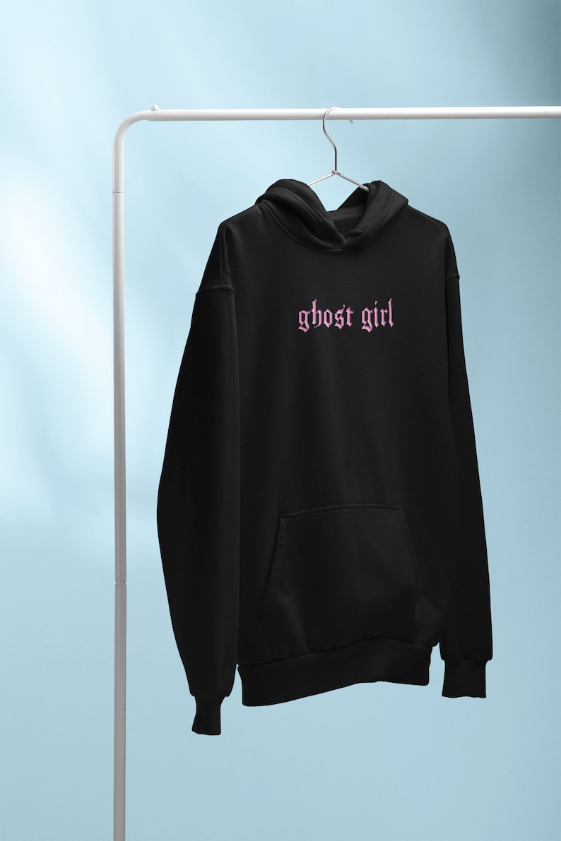 May include: Black hooded sweatshirt with a pink embroidered "ghost girl" graphic.