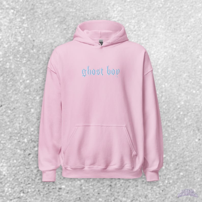 May include: A pink hooded sweatshirt with the text "ghost boy" in blue embroidered on the front.