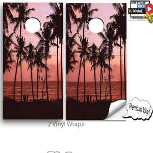 May include: Two vinyl wraps for a cornhole game featuring a sunset scene with palm trees silhouetted against a pink and orange sky. The wraps are shown on a white background with a smaller image of a cornhole board with the same design. The text "2 Vinyl Wraps" and "What They Look Like" are also included in the image.