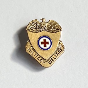 WW II U.S. Military Welfare Red Cross lapel badge in Sterling Silver. Circa 1939/45