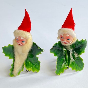 A Gorgeous Pair of Vintage Composition Chenille Santa Claus Ornaments Hard Plastic Faces and Holly Made in Japan Circa 1950’s