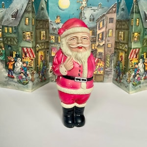 Vintage Japanese Celluloid Santa Claus with a Doll Behind his Back 7 1/2” Circa 1940’S