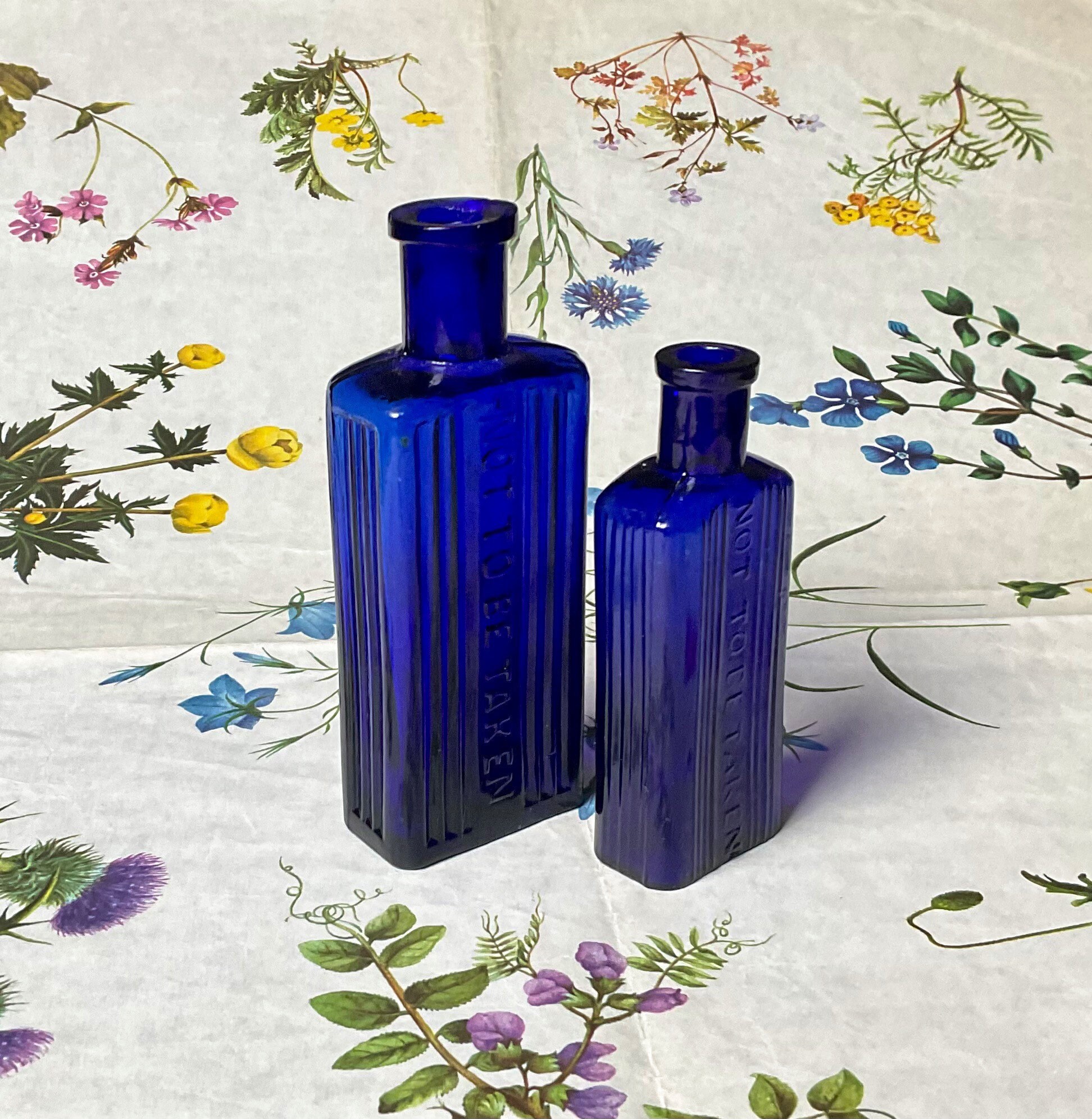 Two antique cobalt blue poison bottles 2 ounce and 4 ounce rectangular