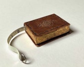 Vintage Novelty Tape Measure in the form of a Leather bound Book Circa 1930 s
