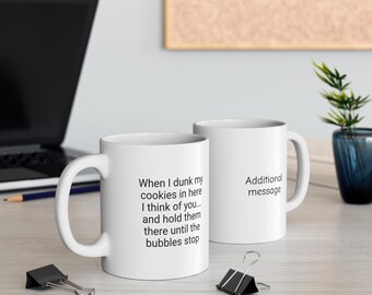 May include: Two white ceramic mugs with black text. One mug reads "When I dunk my cookies in here I think of you... and hold them there until the bubbles stop." The other mug has the text "Additional message."