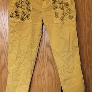 Upcycled Yellow Pants With Stamped Eye Designs