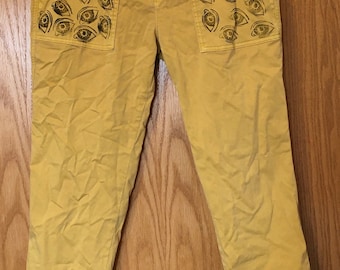 Upcycled Yellow Pants With Stamped Eye Designs