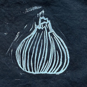 May include: A white onion illustration on a dark navy blue background. The onion is depicted with vertical lines and a textured appearance, suggesting a linocut or printmaking technique. The image has a simple, graphic style.