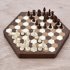 May include: A hexagonal chessboard with brown and white hexagonal tiles. The board is set up for a game of chess with white and brown chess pieces.