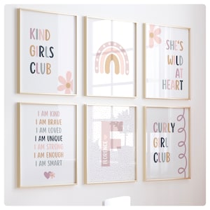 May include: Set of six framed prints with inspirational quotes and illustrations. The prints feature a rainbow, a flower, and text such as "Kind Girls Club", "She's Wild at Heart", and "Curly Girl Club".