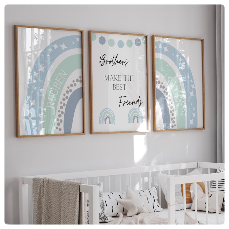 May include: Three framed prints with a blue and green rainbow design. The center print has the text "Brothers make the best friends" with two smaller rainbows below. The left and right prints have the names "Reuben" and "Aiden" written inside the rainbows.