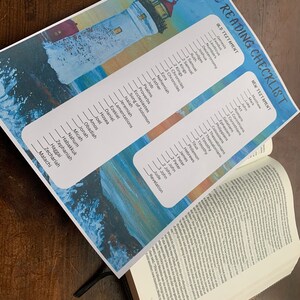 May include: A printable checklist for reading the Bible. The checklist is divided into two sections: Old Testament and New Testament. The Old Testament section features a lighthouse with a blue and white sky background. The New Testament section features a blue and white ocean wave background.