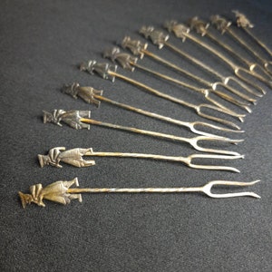 vintage silver plated hors doeuvre appetizer picks forks man with flute