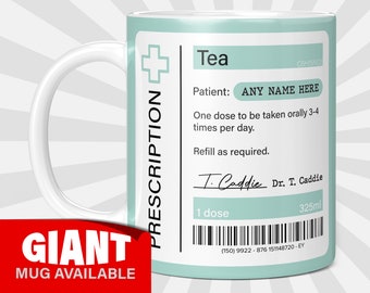 May include: A white ceramic mug with a light blue design that looks like a prescription label. The label says "Tea" and "Prescription" and has a barcode. The text on the label says "One dose to be taken orally 3-4 times per day. Refill as required. Dr. T. Caddie 325ml (150) 9922-876 151148720 - EY".