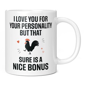 May include: White ceramic mug with a black rooster illustration and the text "I LOVE YOU FOR YOUR PERSONALITY BUT THAT SURE IS A NICE BONUS". The mug has a curved handle and is suitable for hot or cold beverages.
