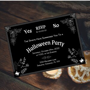 May include: Black and white Halloween party invitation with a spooky hand design and the text "Yes RSVP By 10/20/22 No THE SPIRITS HAVE SUMMONED You To A Halloween Party SATURDAY, OCTOBER 29TH, 2022 AT 7:00, IN THE EVENING 1234 MACABRE LANE SKELETAL CROSSING, FL 11111"