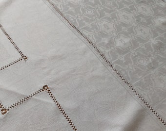 An antique French fine linen damask tablecloth with drawn threadwork embroidery.  Would benefit from some small repairs.  Superb quality.