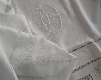 Beautifully embroidered pure finest linen panel offcut from an antique French bedsheet with interlaced monogram OGO.  235 x 121 cm