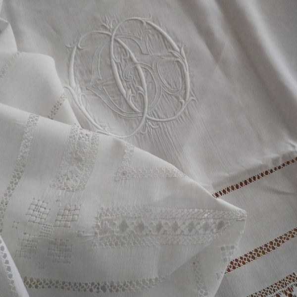 Beautifully embroidered pure finest linen panel offcut from an antique French bedsheet with interlaced monogram OGO.  235 x 121 cm