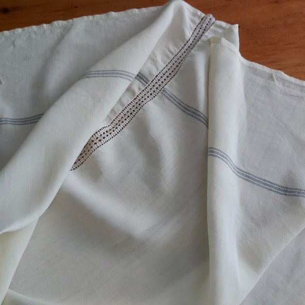 An unusual vintage French tablecloth in buttermilk pure linen with blue stripe and a crochet lace insert / sewing fabric.