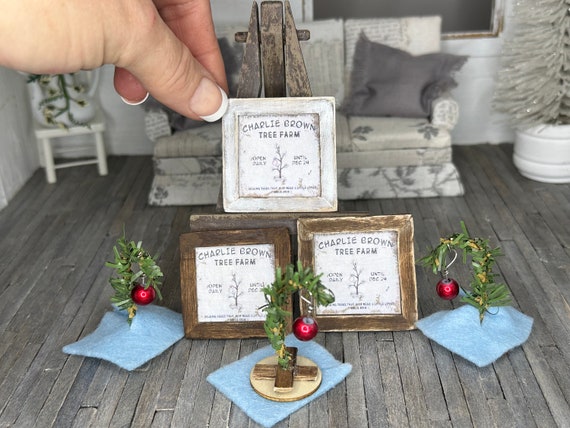 Miniature dollhouse Charlie Brown trees and framed Charlie Brown tree farm picture