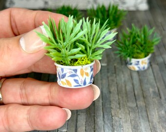 Miniature dollhouse plant in blue and yellow planter, dollhouse flower