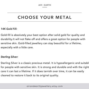 May include: Text on a white background explaining the difference between 14K gold fill and sterling silver jewelry. The text says "Choose Your Metal" and includes the website address airandearthjewellery.etsy.com.