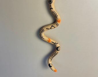 Handmade ceramic orange and black with painted Fertility symbols Snake Talisman