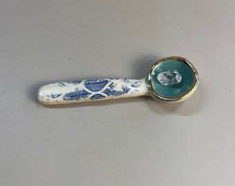 Handmade ceramic aqua and blue leaf spoon with gold luster rim.