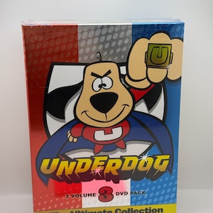 May include: Underdog 3-volume DVD pack. The box features a cartoon dog character in a superhero costume. The box has a red, white, and blue color scheme. The text on the box reads "Underdog", "3 Volume DVD Pack", and "The Ultimate Collection."